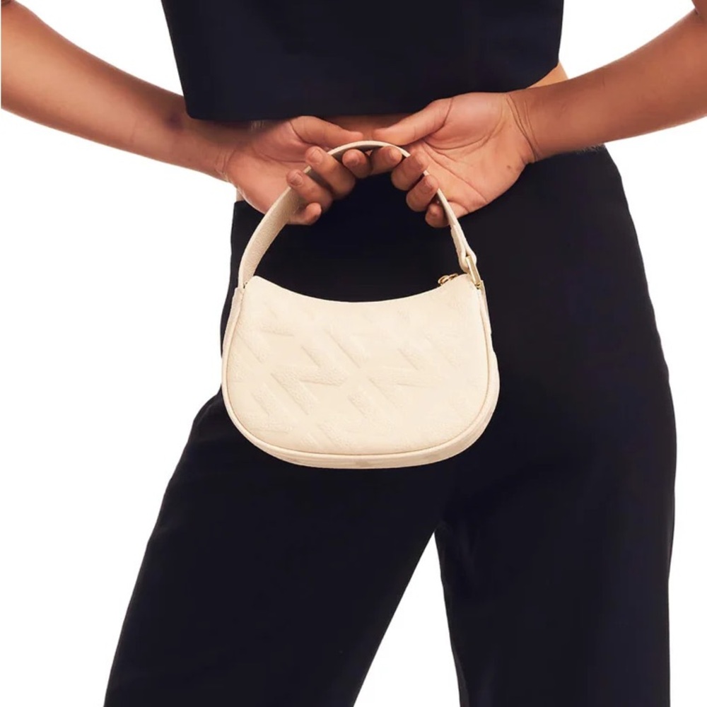 The mini ivory nakedvice bag
Never been used